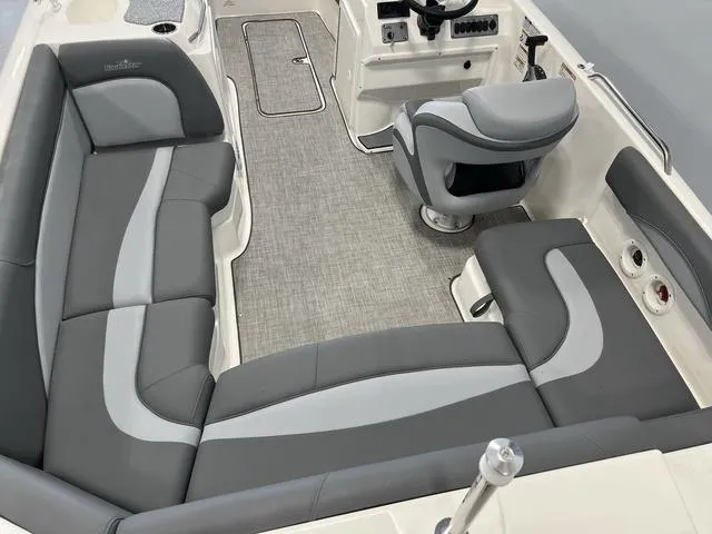 Slide: The Image of 2023 NauticStar 203 SC boat interior with gray seating and modern helm. - 6