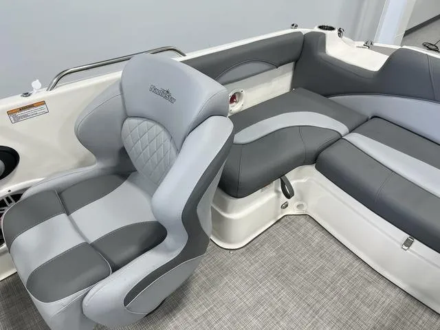 Slide: The Image of 2023 NauticStar 203 SC boat interior with gray seating and modern design. - 7