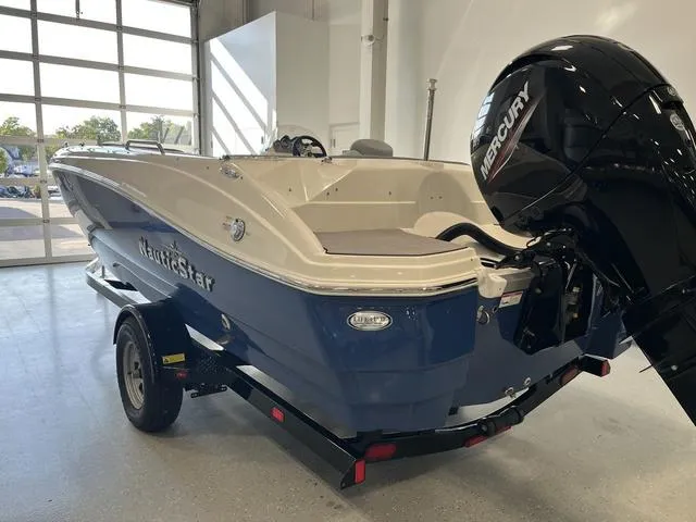 Slide: The Image of 2024 NauticStar 203 SC boat with Mercury engine in showroom. - 3