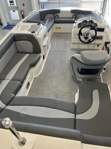 Slide: The Image of 2024 NauticStar 203 SC boat interior with gray seating and modern dashboard. - 4