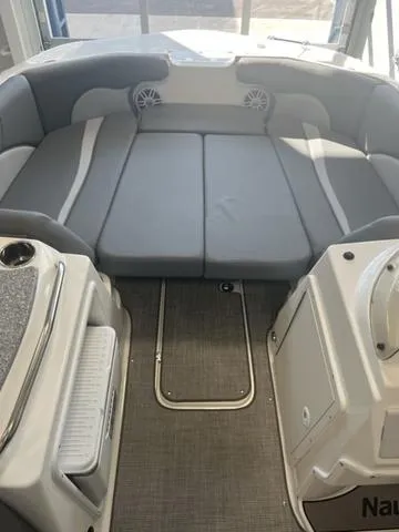 Slide: The Image of 2024 NauticStar 203 SC boat interior with gray seating and modern design. - 5