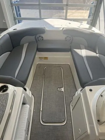 Slide: The Image of 2024 NauticStar 203 SC boat interior with gray seating and carpeted floor. - 6