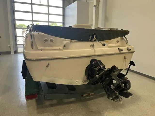 Slide: The Image of 2003 Hurricane GS 203 Fundeck boat in indoor storage, rear view. - 3