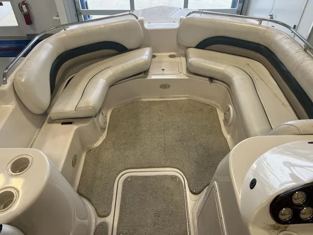 Slide: The Image of 2003 Hurricane GS 203 Fundeck interior with spacious seating and carpeted floor. - 5