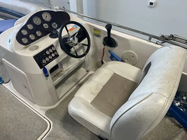 Slide: The Image of 2003 Hurricane GS 203 Fundeck boat interior with steering wheel and control panel. - 6
