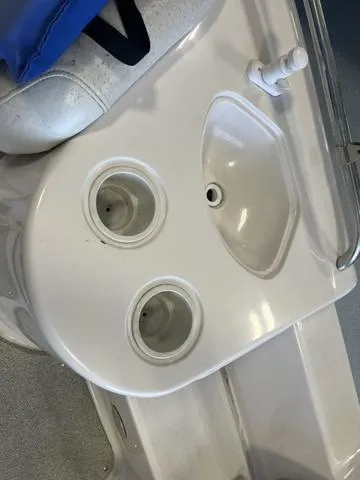 Slide: The Image of 2003 Hurricane GS 203 Fundeck boat sink and cup holders. - 8