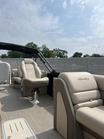 Slide: The Image of 2024 Bentley Pontoons Elite 223 Admiral interior with luxurious seating and sleek design. - 14