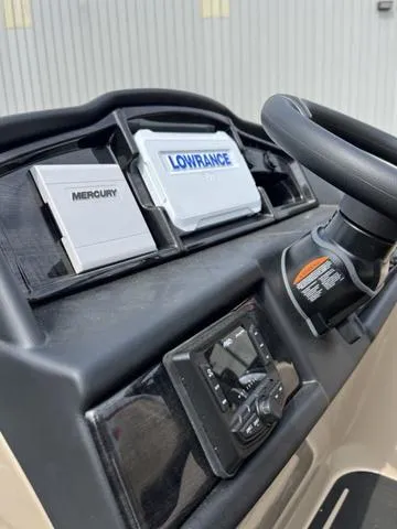 Slide: The Image of 2024 Bentley Pontoons Elite 223 Admiral dashboard with Mercury and Lowrance displays. - 17