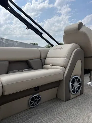Slide: The Image of 2024 Bentley Pontoons Elite 223 Admiral interior with luxurious seating and speaker system. - 18