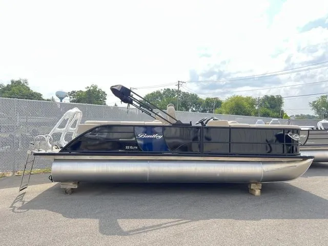 Slide: The Image of 2024 Bentley Pontoons Elite 223 Admiral 3/4 Tube, sleek design, parked outdoors. - 5