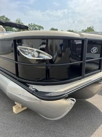 Slide: The Image of 2024 Bentley Pontoons Elite 223 Admiral 3/4 Tube, sleek black design, docked outdoors. - 6