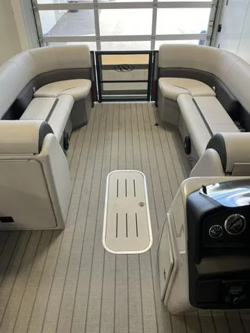 Slide: The Image of 2024 Bentley Pontoons Legacy 243 Navigator interior with plush seating and modern design. - 6