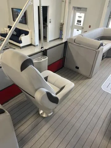 Slide: The Image of 2024 Bentley Pontoons Legacy 243 Navigator interior with plush seating and modern design. - 7