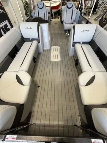 Slide: The Image of 2024 Bentley Pontoons Legacy 243 Navigator interior with spacious seating and modern design. - 9