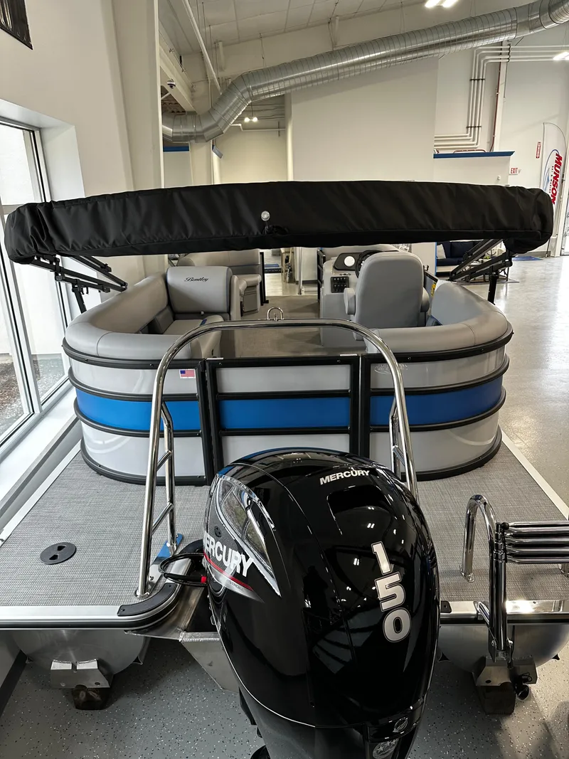 Slide: The Image of 2025 Bentley Pontoons Bolt with Mercury 150 engine in showroom. - 3