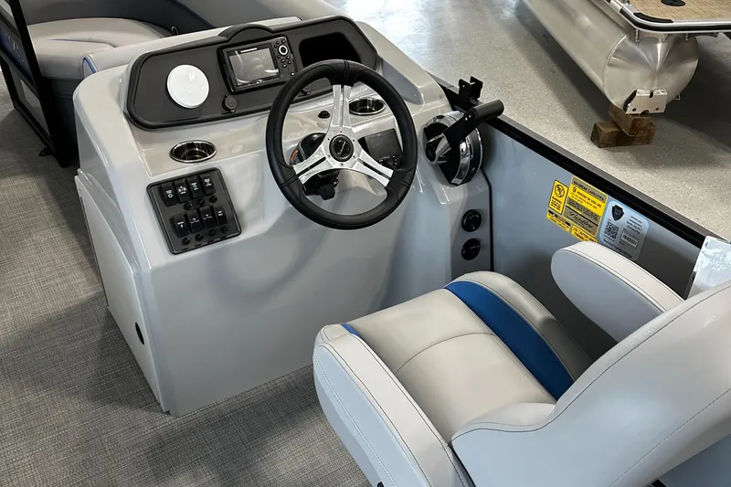 Slide: The Image of 2025 Bentley Pontoons Bolt interior with steering wheel and control panel. - 7