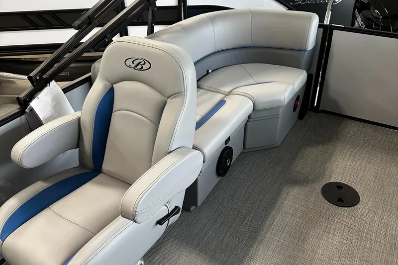 Slide: The Image of 2025 Bentley Pontoons Bolt interior with luxurious gray and blue seating. - 8