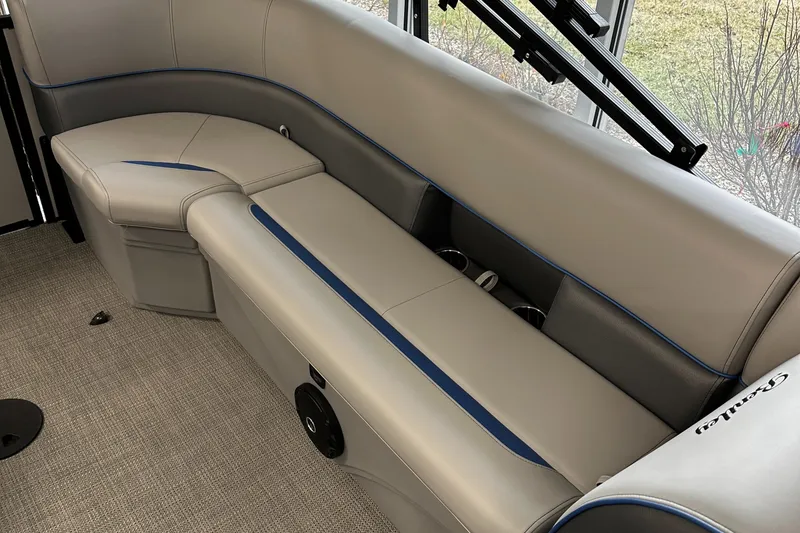 Slide: The Image of 2025 Bentley Pontoons Bolt interior with sleek gray seating and blue accents. - 9