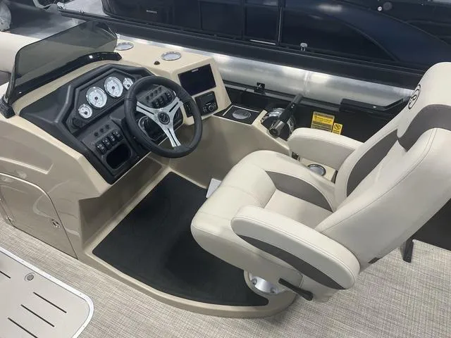 Slide: The Image of 2025 Bentley Pontoons 223 Swingback cockpit with modern controls and comfortable seating. - 4