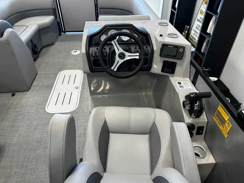 Slide: The Image of 2025 Bentley Pontoons 223 NAVIGATOR interior with modern steering and seating. - 5
