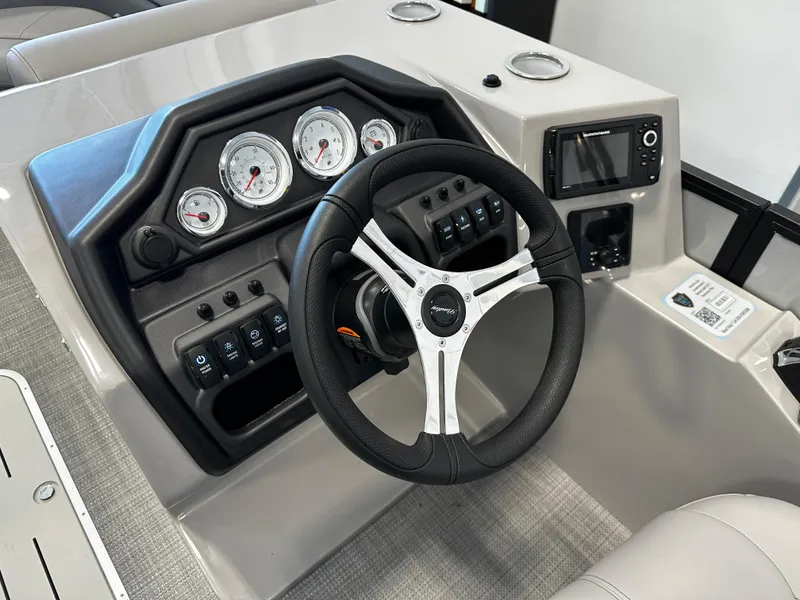 Slide: The Image of 2025 Bentley Pontoons 223 NAVIGATOR dashboard with steering wheel and gauges. - 6