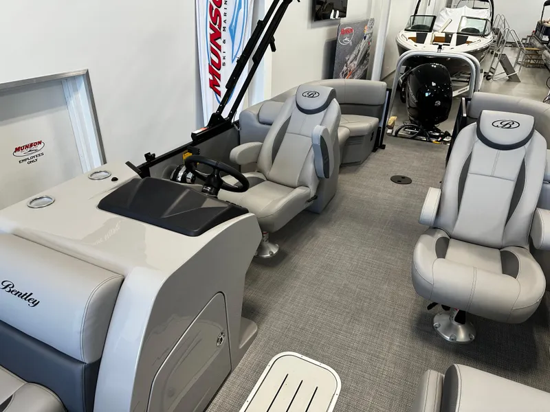 Slide: The Image of 2025 Bentley Pontoons 223 NAVIGATOR interior with plush seating and modern helm. - 9