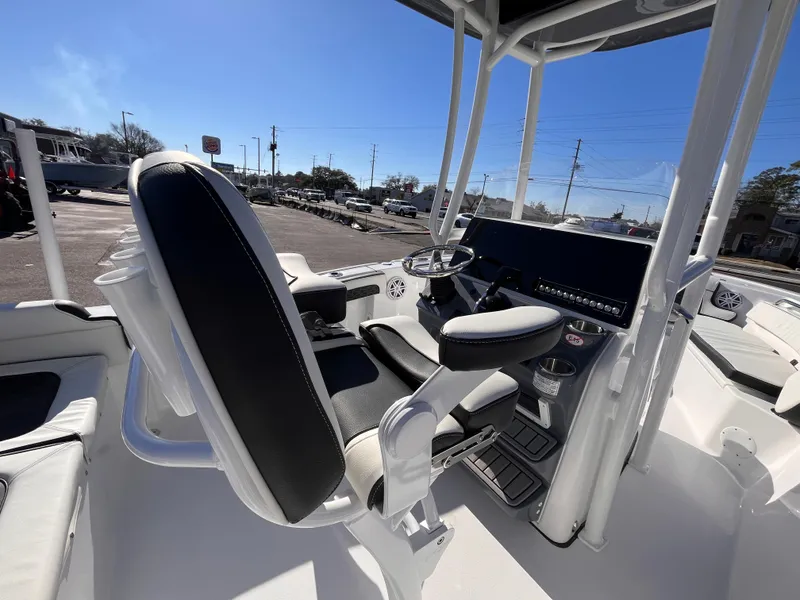 Slide: The Image of 2025 Tidewater 210 LXF boat interior with modern helm and seating. - 6