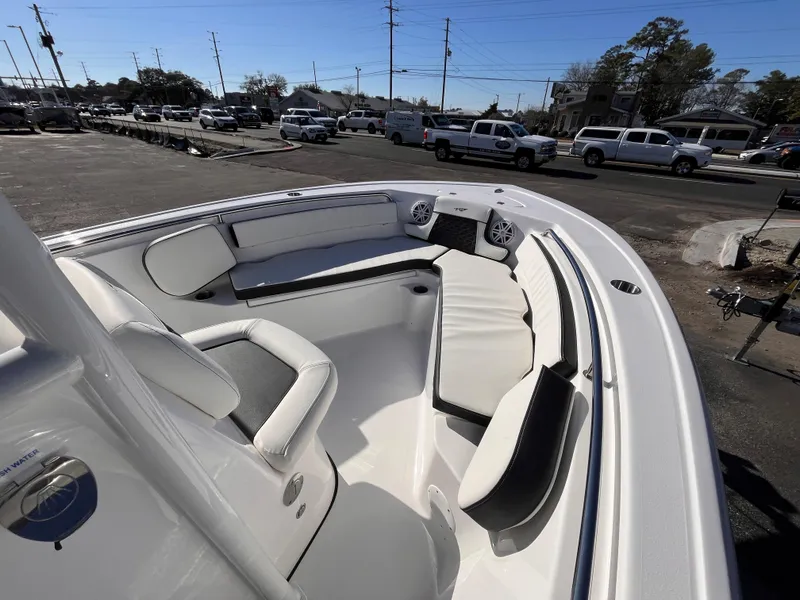 Slide: The Image of 2025 Tidewater 210 LXF boat interior with white seating and modern design. - 9