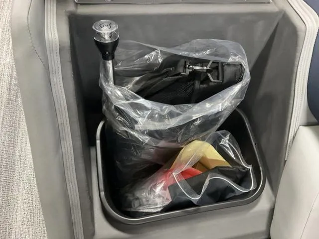 Slide: The Image of Storage compartment in 2025 Bennington 23 SSB boat with packaged accessories. - 13