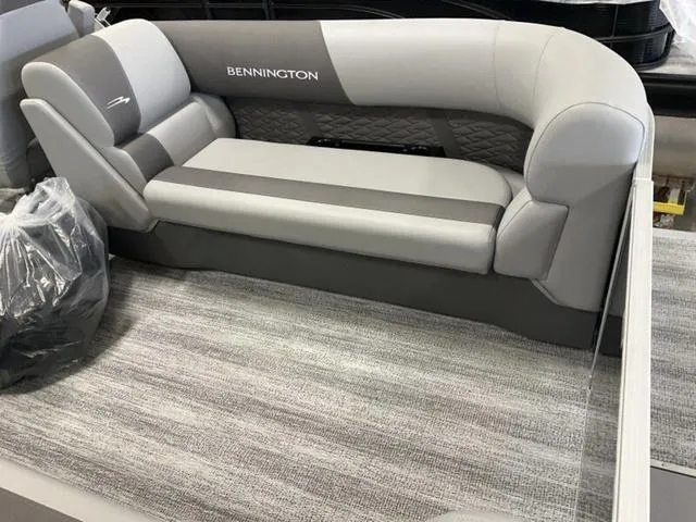 Slide: The Image of 2025 Bennington 22 SSR boat interior with gray seating and modern design. - 10