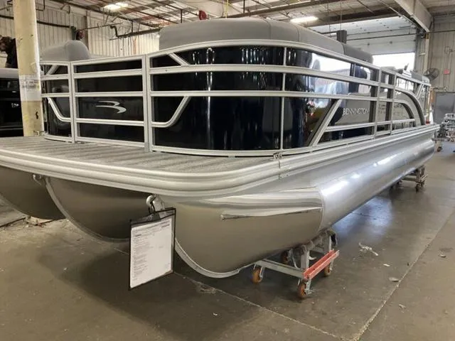 Slide: The Image of 2025 Bennington 22 SSR pontoon boat in a warehouse setting. - 3