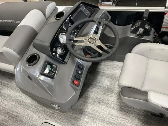 Slide: The Image of 2025 Bennington 22 SSR boat dashboard with steering wheel and controls. - 5