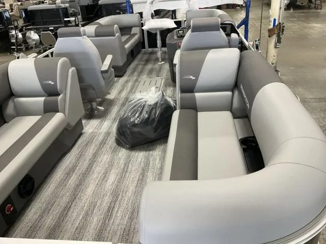 Slide: The Image of 2025 Bennington 22 SSR pontoon boat interior with gray seating and modern design. - 6