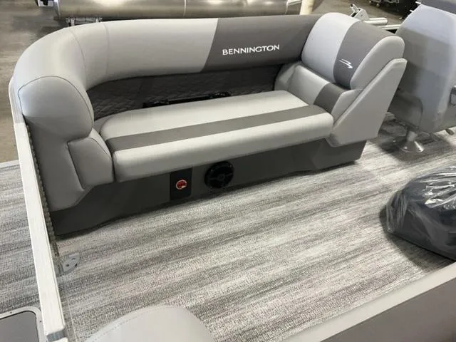 Slide: The Image of 2025 Bennington 22 SSR boat interior with gray seating and carpet flooring. - 7