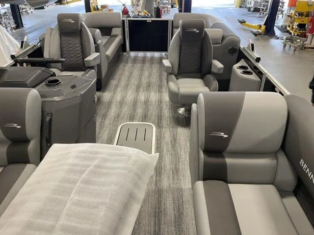 Slide: The Image of 2025 Bennington 22 SSR pontoon boat interior with gray seating and modern design. - 9