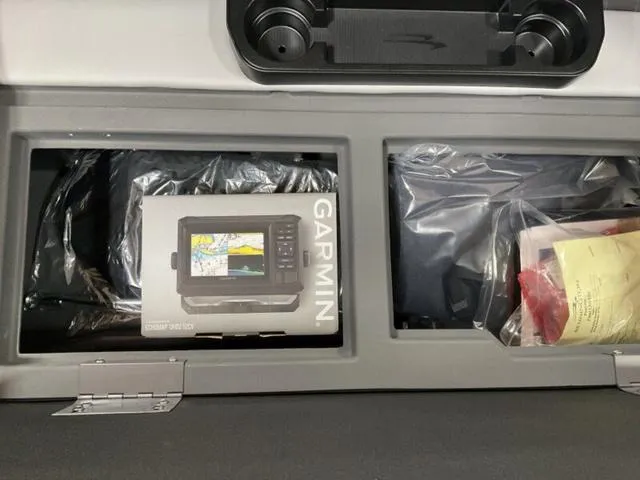 Slide: The Image of Storage compartment in a 2025 Bennington 22 SSB with Garmin device box. - 12