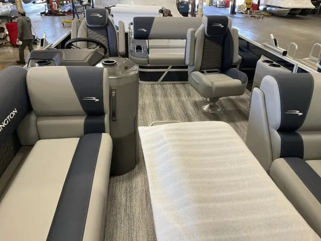 Slide: The Image of 2025 Bennington 22 SSB pontoon boat interior with plush seating and modern design. - 6