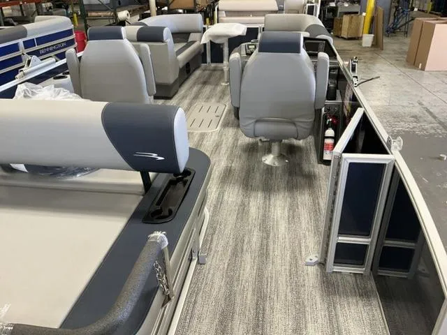 Slide: The Image of 2025 Bennington 22 SSB pontoon boat interior with gray seating and flooring. - 7