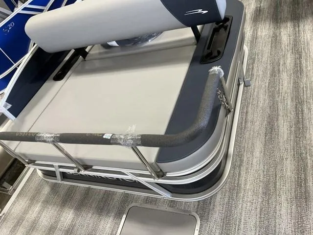 Slide: The Image of 2025 Bennington 22 SSB boat interior with cushioned seating and railing. - 8