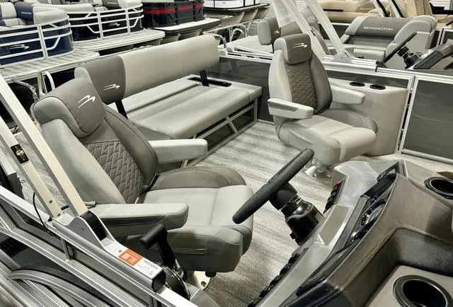 Slide: The Image of 2025 Bennington 22 SSB boat interior with plush seating and modern design. - 12