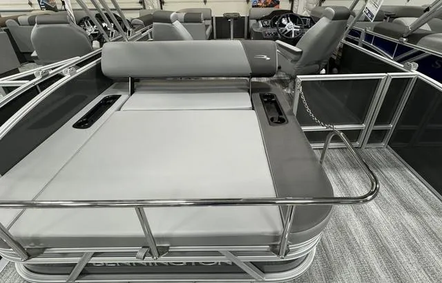 Slide: The Image of 2025 Bennington 22 SSB pontoon boat interior with sleek seating and modern design. - 16