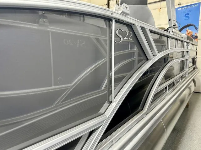 Slide: The Image of 2025 Bennington 22 SSB pontoon boat with sleek silver design and modern detailing. - 20