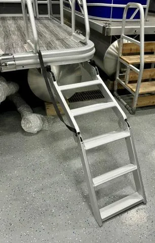 Slide: The Image of 2025 Bennington 22 SSB boat ladder on a showroom floor. - 21