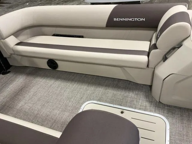 Slide: The Image of 2025 Bennington 23 SL boat interior with beige and brown seating. - 5