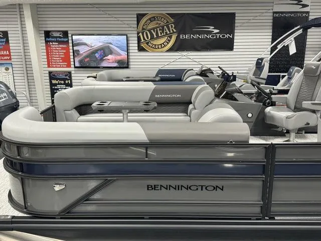 Slide: The Image of 2025 Bennington 23 SSB pontoon boat with luxurious seating and modern design in showroom. - 4