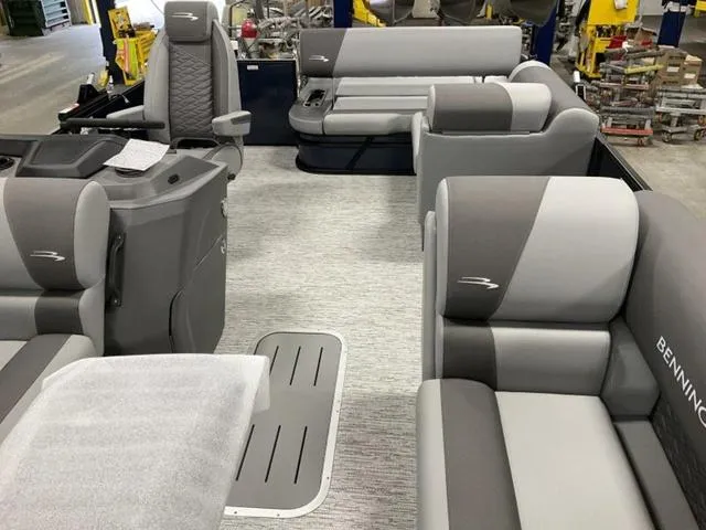 Slide: The Image of 2025 Bennington 23 SSB boat interior with gray seating and modern design. - 9