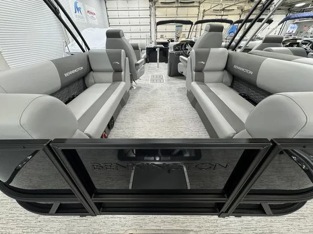 Slide: The Image of 2025 Bennington 22 SSR pontoon boat interior with gray seating and modern design. - 21