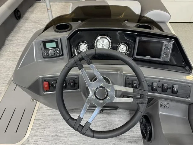 Slide: The Image of Steering console of 2025 Bennington 22 SSB boat with modern controls and gauges. - 14