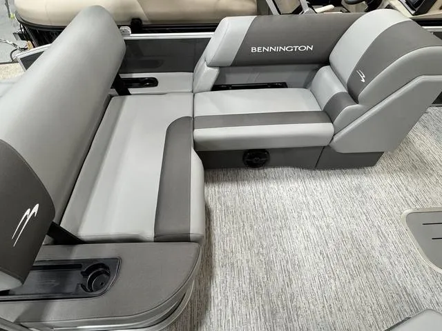 Slide: The Image of 2025 Bennington 22 SSB boat interior with gray seating and logo. - 17