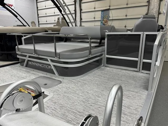 Slide: The Image of 2025 Bennington 22 SSB pontoon boat interior with gray seating and sleek design. - 20